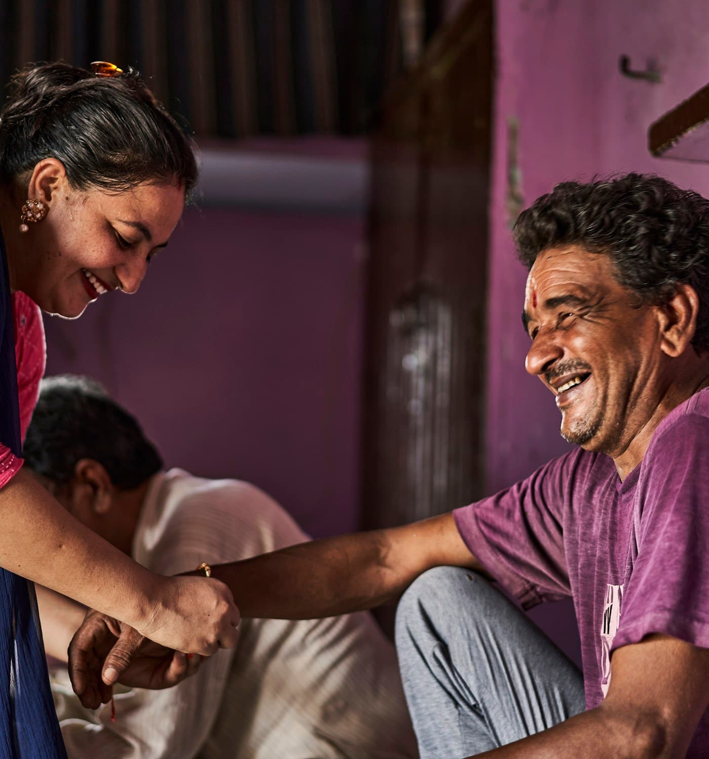 A young woman sharing a warm moment with an older family member